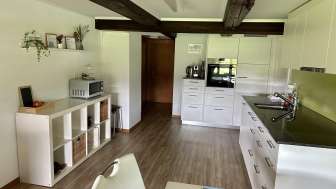 Kueche und Wohnbereich der Unterkunft